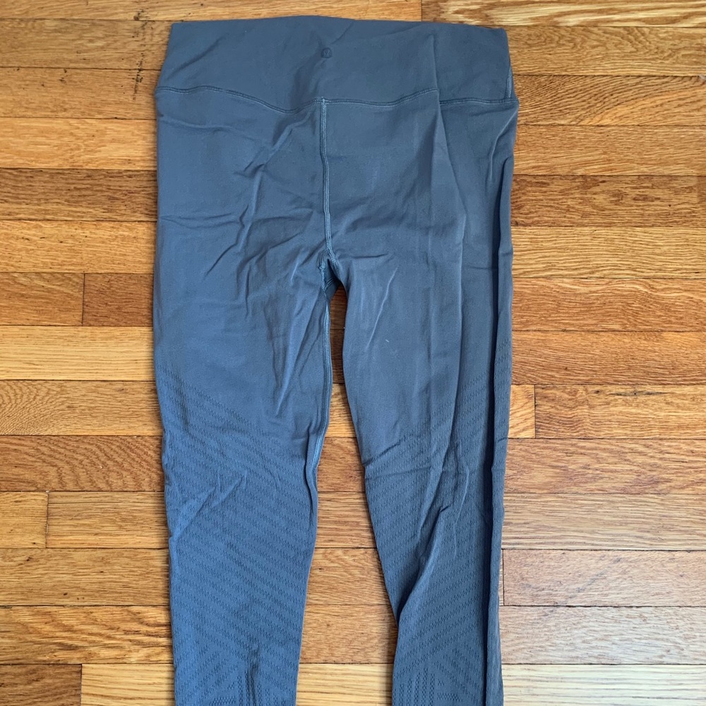 Lululemon grey leggings with design on bottom half